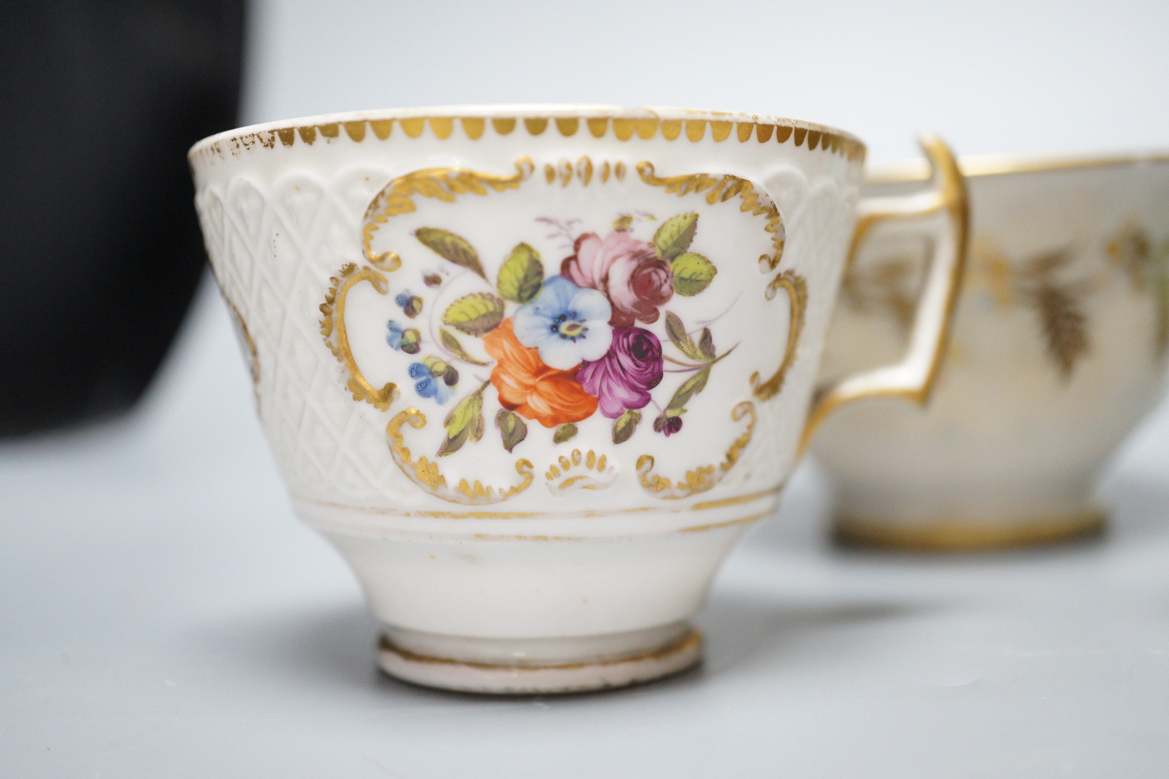 A small bone china pot pourri, possibly Spode, a relief moulded teacup and saucer, and three cups